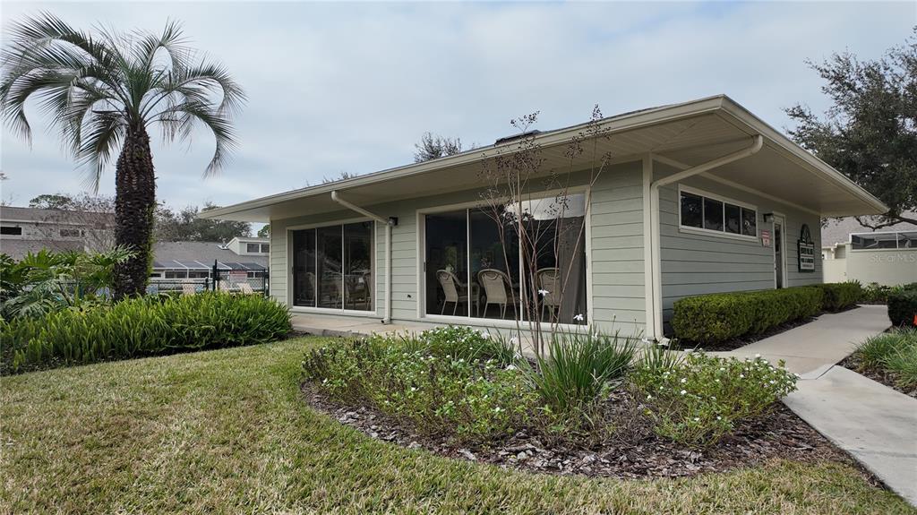 1767 Southeast 27th Loop Ocala, FL 34471 - Photo 79 of 79 a view of a house with a yard and potted plants