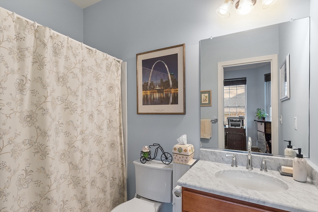 33 Summerfield Drive, Unit 33 Uxbridge, MA 01569 - Photo 8 of 21 a bathroom with a granite countertop sink and a mirror