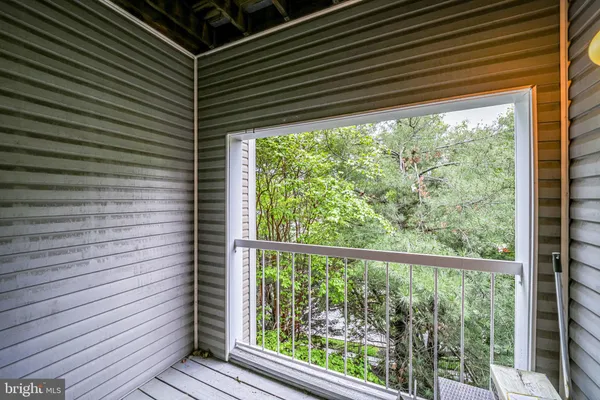 a view of a room that has a wooden floor