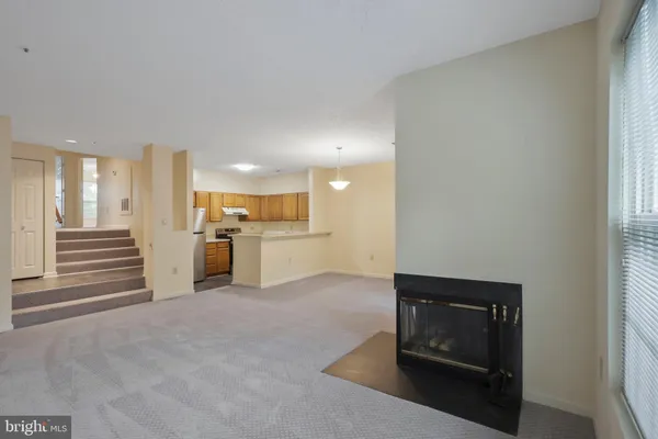 a view of a kitchen with a sink and cabinets