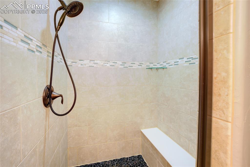 1112 Spectrum Loop Colorado Springs, CO 80921 - Photo 13 of 50 Full bathroom featuring tiled shower