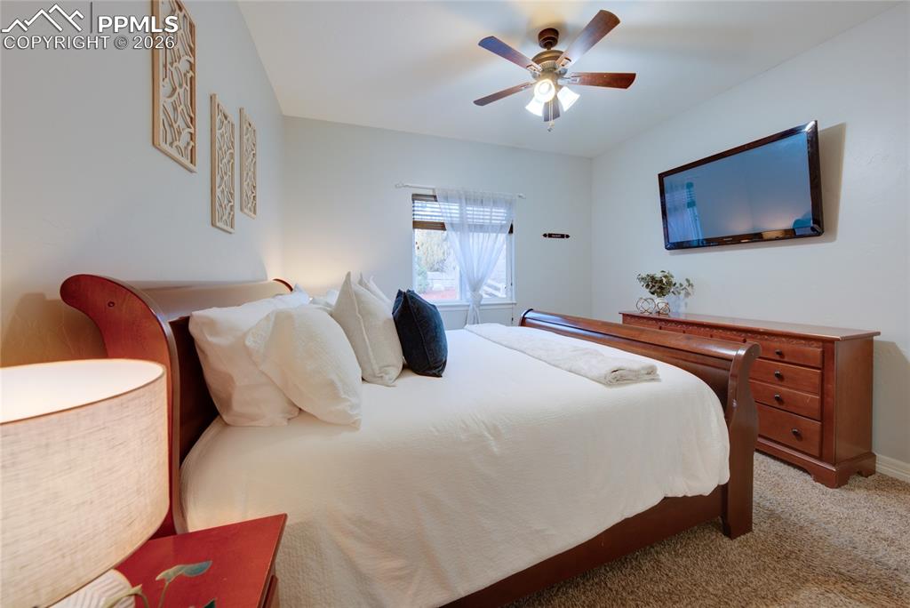 1112 Spectrum Loop Colorado Springs, CO 80921 - Photo 17 of 50 Carpeted bedroom with ceiling fan