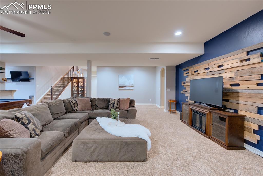 1112 Spectrum Loop Colorado Springs, CO 80921 - Photo 25 of 50 Carpeted living room with billiards table, stairway, and recessed lighting