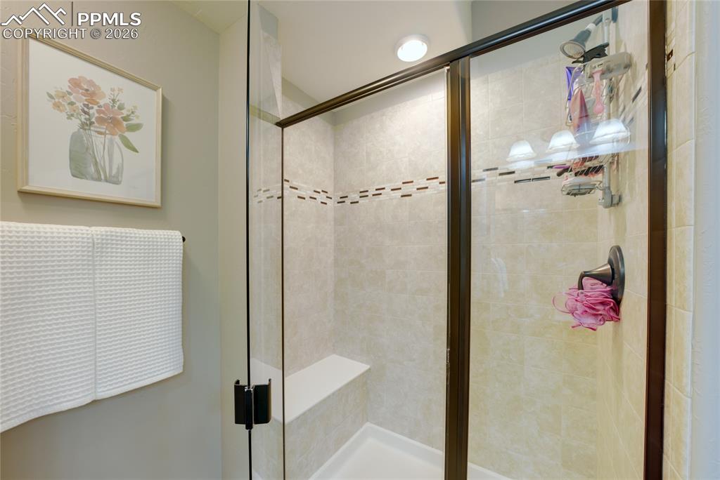 1112 Spectrum Loop Colorado Springs, CO 80921 - Photo 34 of 50 Full bathroom with a stall shower
