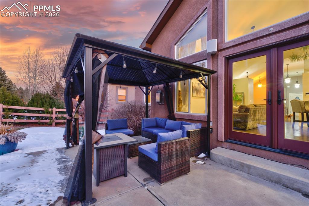 1112 Spectrum Loop Colorado Springs, CO 80921 - Photo 38 of 50 View of patio / terrace featuring an outdoor living space, a gazebo, and french doors