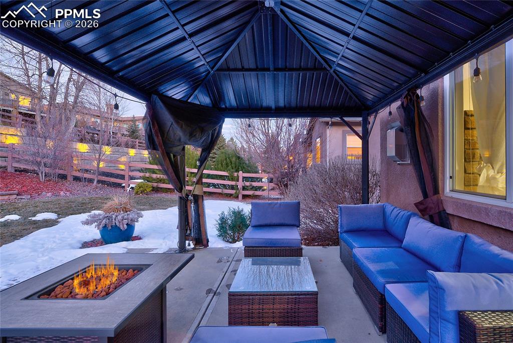 1112 Spectrum Loop Colorado Springs, CO 80921 - Photo 39 of 50 View of patio / terrace with an outdoor living space with a fire pit