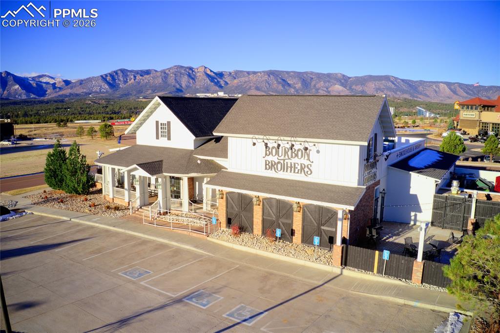 1112 Spectrum Loop Colorado Springs, CO 80921 - Photo 49 of 50 View of building exterior featuring a mountain view