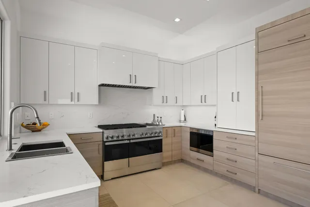 a view of a kitchen with a sink and garden