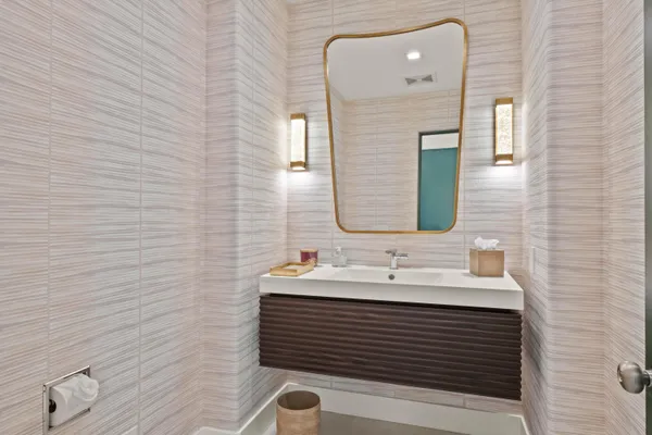 a bedroom with a bed and a night stand