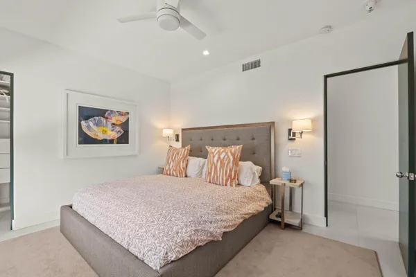 a living room with furniture and wall painting