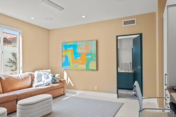 a bathroom with a double vanity sink mirror and shower