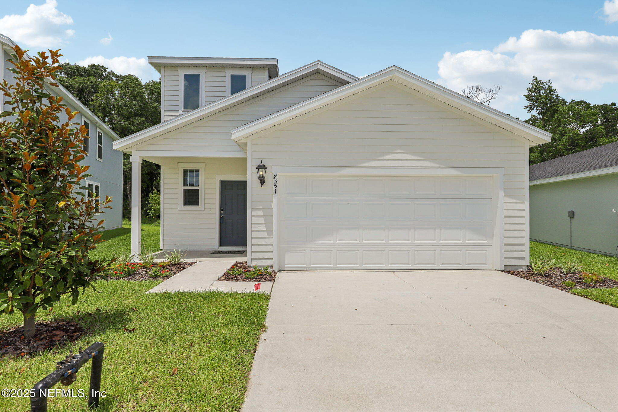 a front view of house with yard