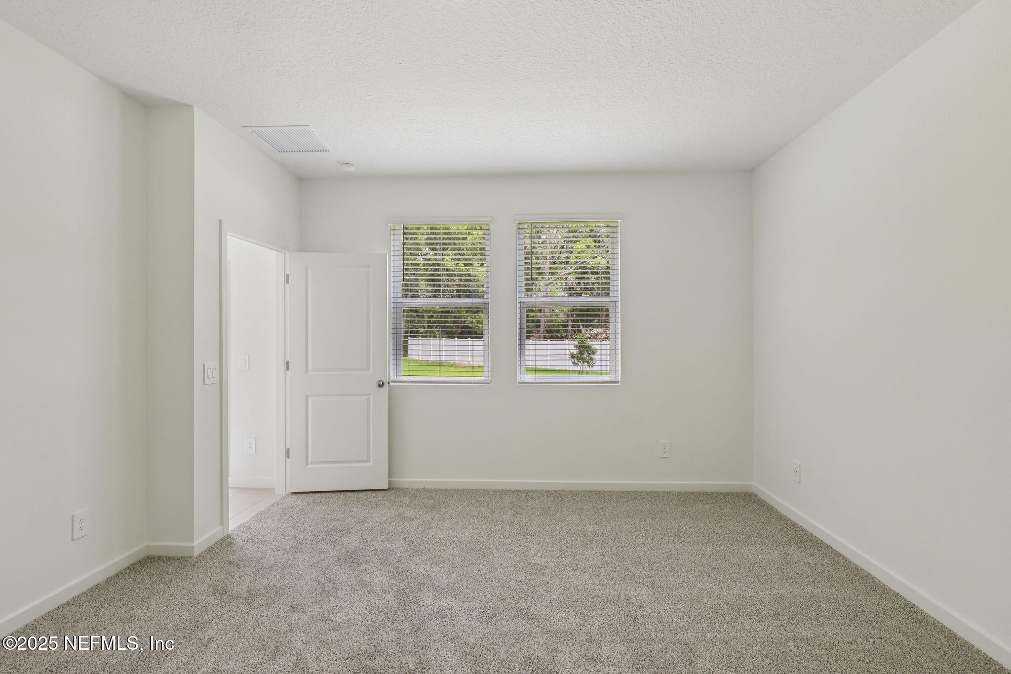 7351 Queensgate Circle Jacksonville, FL 32219 - Photo 19 of 38 an empty room with a window