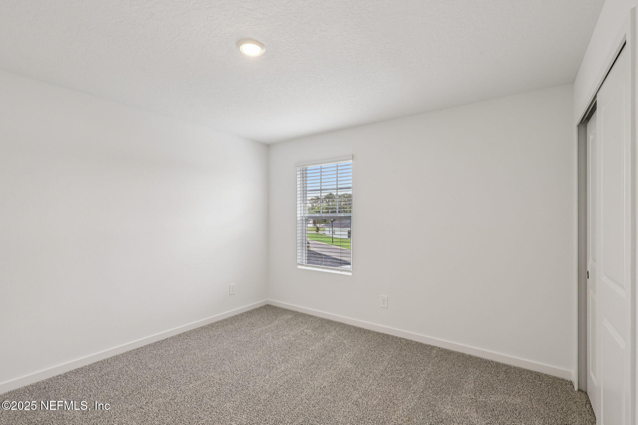 7351 Queensgate Circle Jacksonville, FL 32219 - Photo 25 of 38 a view of an empty room with a window