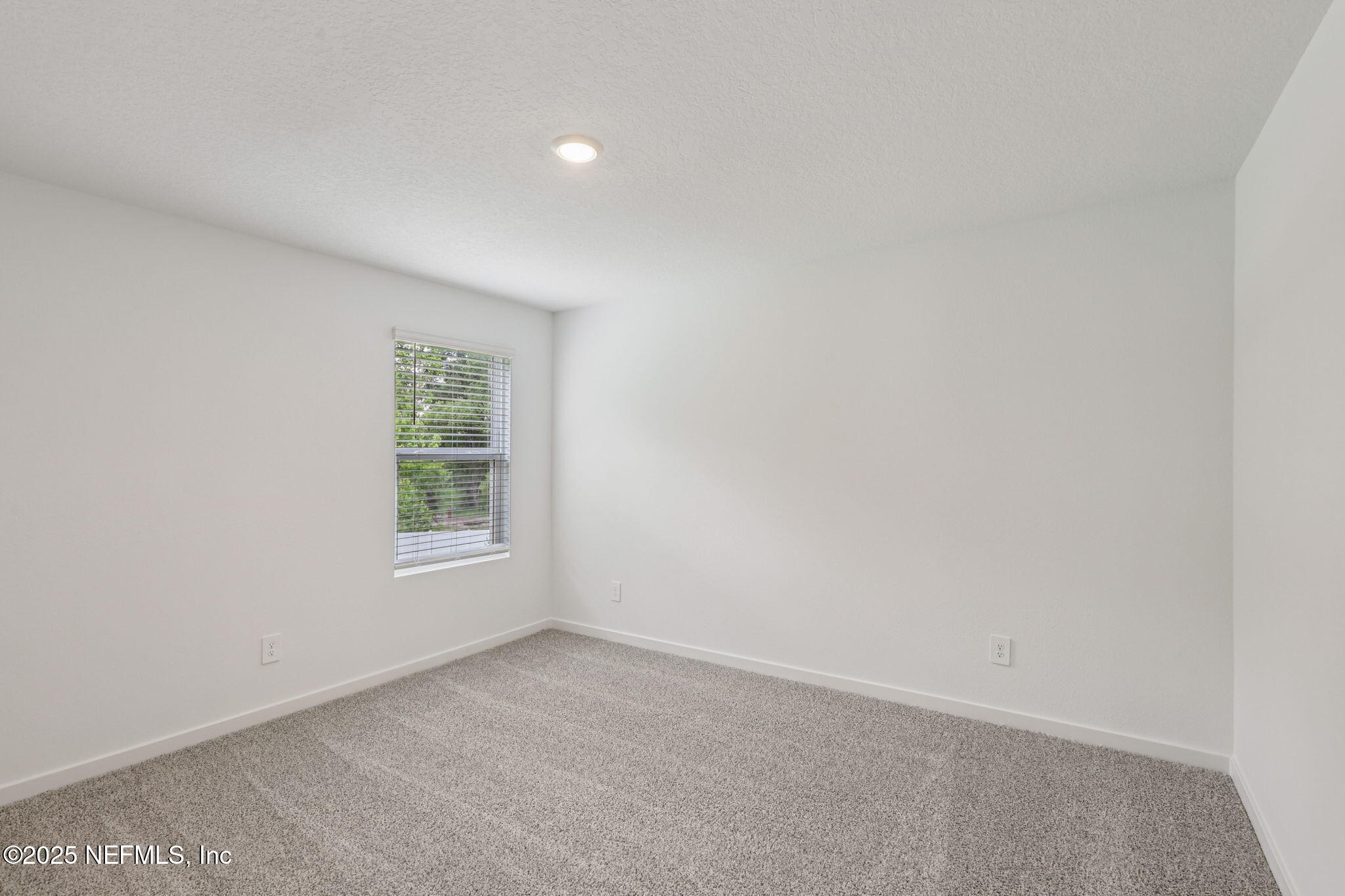 7351 Queensgate Circle Jacksonville, FL 32219 - Photo 29 of 38 an empty room with a window