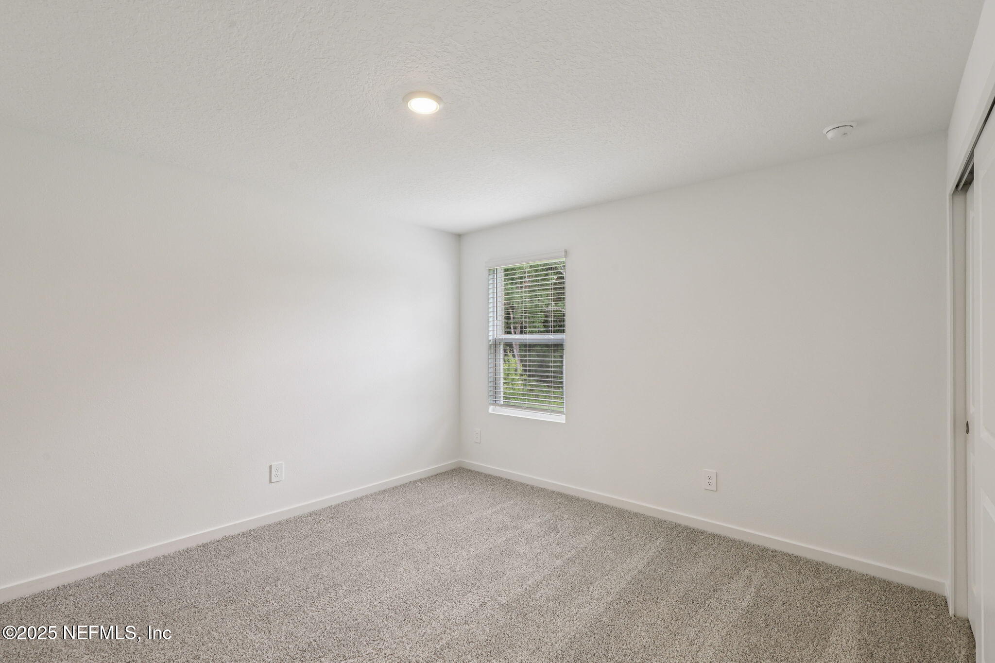 7351 Queensgate Circle Jacksonville, FL 32219 - Photo 31 of 38 an empty room with a window
