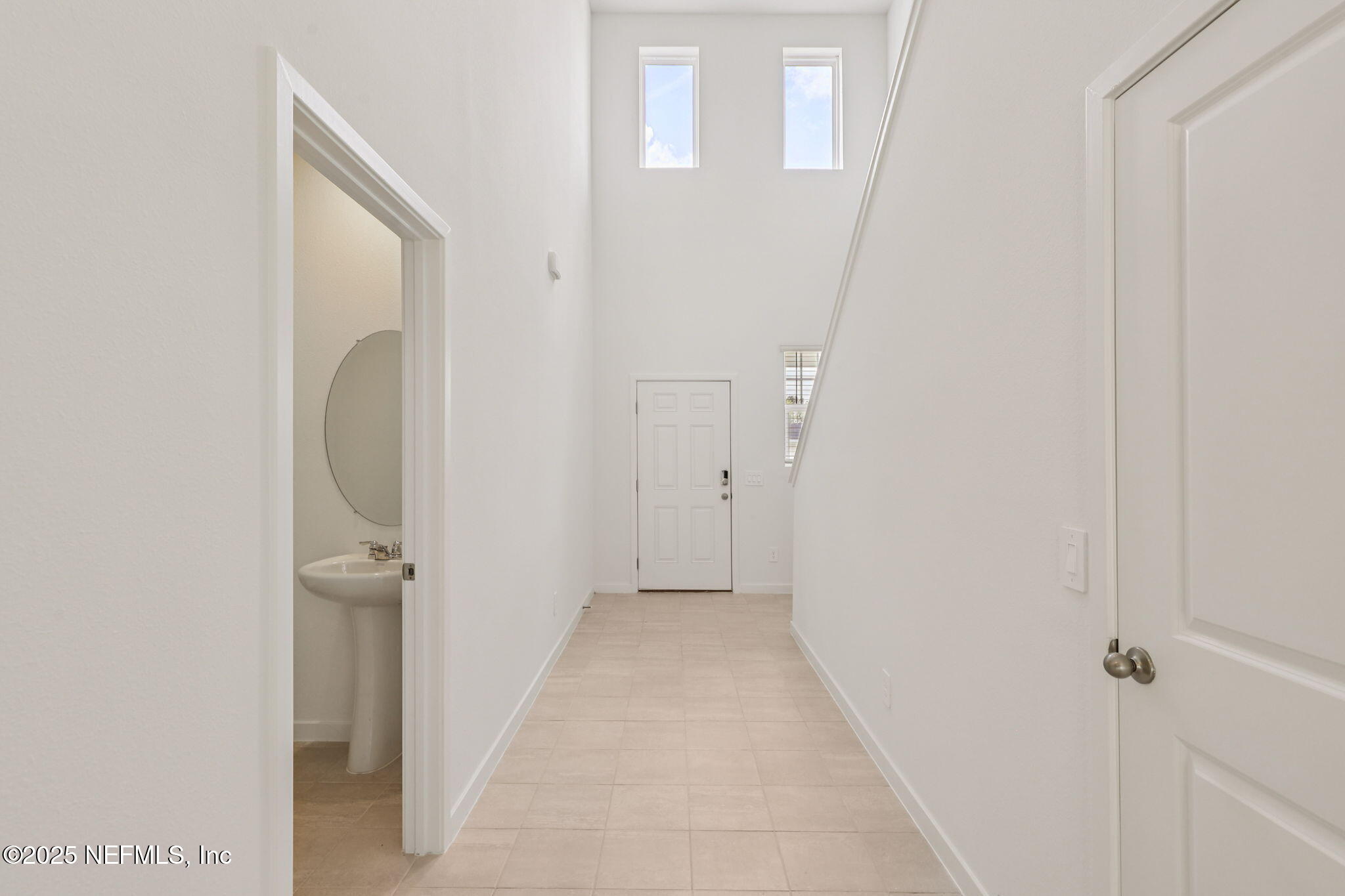 7351 Queensgate Circle Jacksonville, FL 32219 - Photo 6 of 38 a view of a hallway with wooden floor and entryway