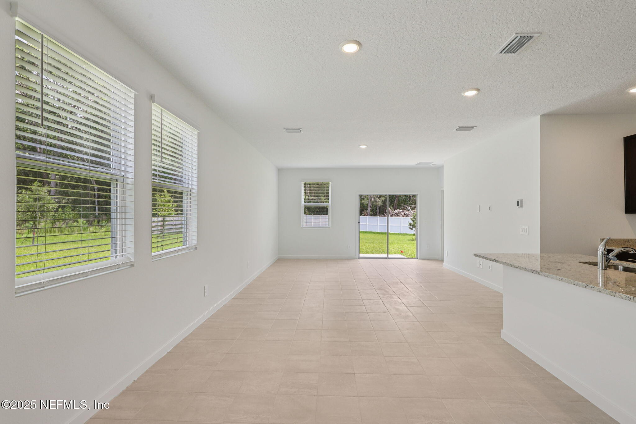 7351 Queensgate Circle Jacksonville, FL 32219 - Photo 8 of 38 a view of an empty room with window