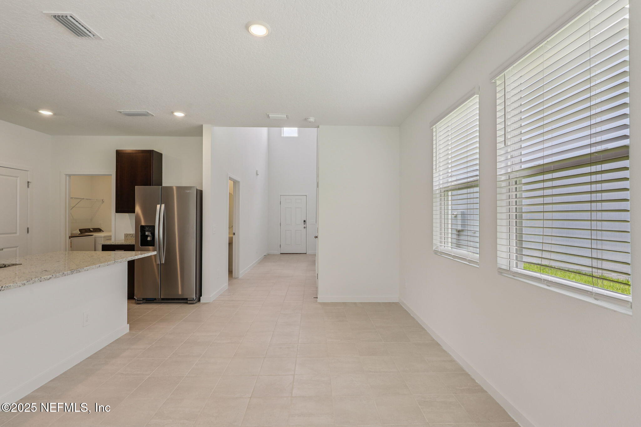7351 Queensgate Circle Jacksonville, FL 32219 - Photo 10 of 38 a view of a kitchen with refrigerator and a sink