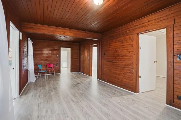 an entryway of a room with wooden floor