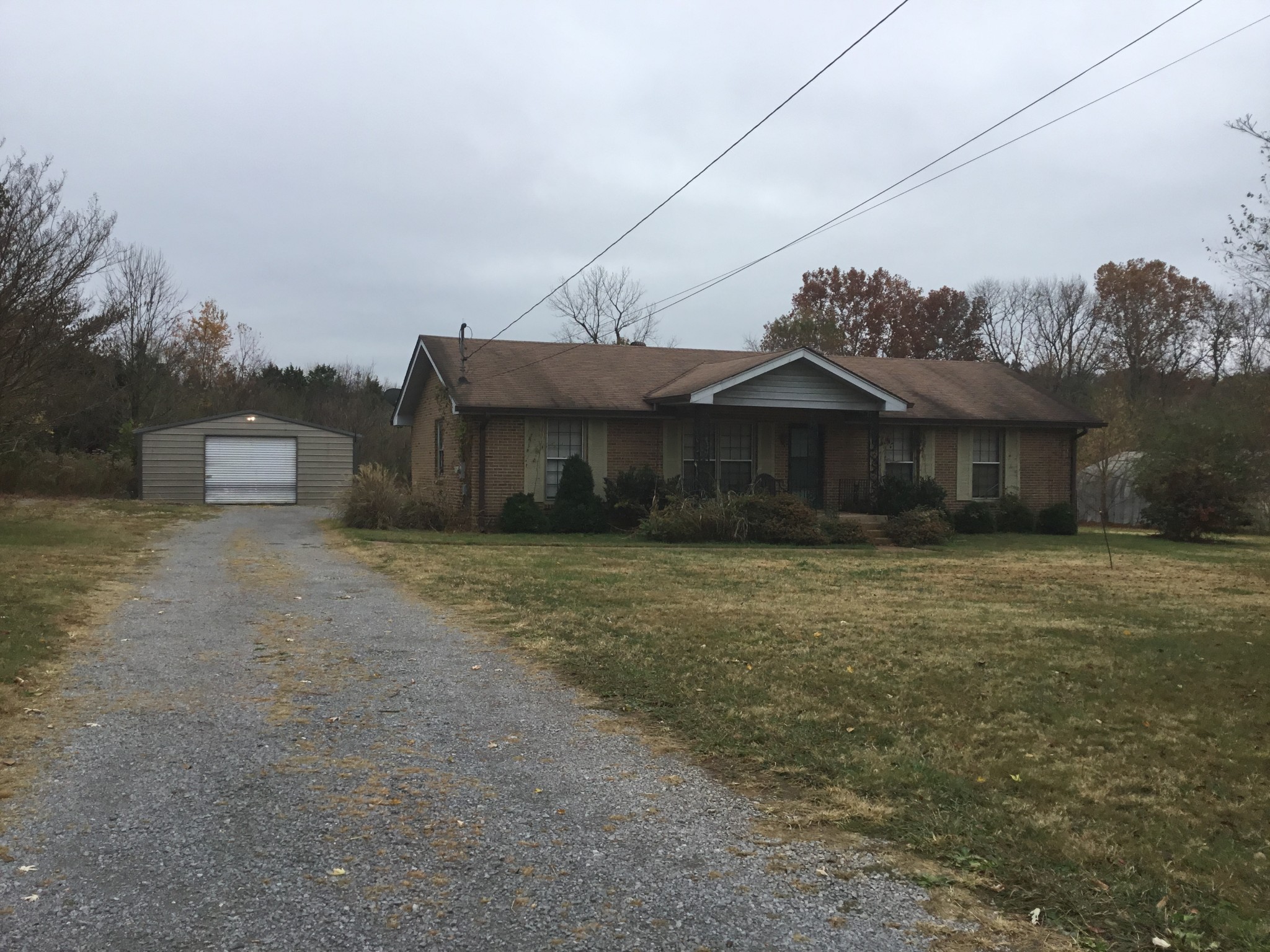 2780 Holloway Road Lebanon, TN 37090 - Photo 1 of 5 a front view of a house with a garden