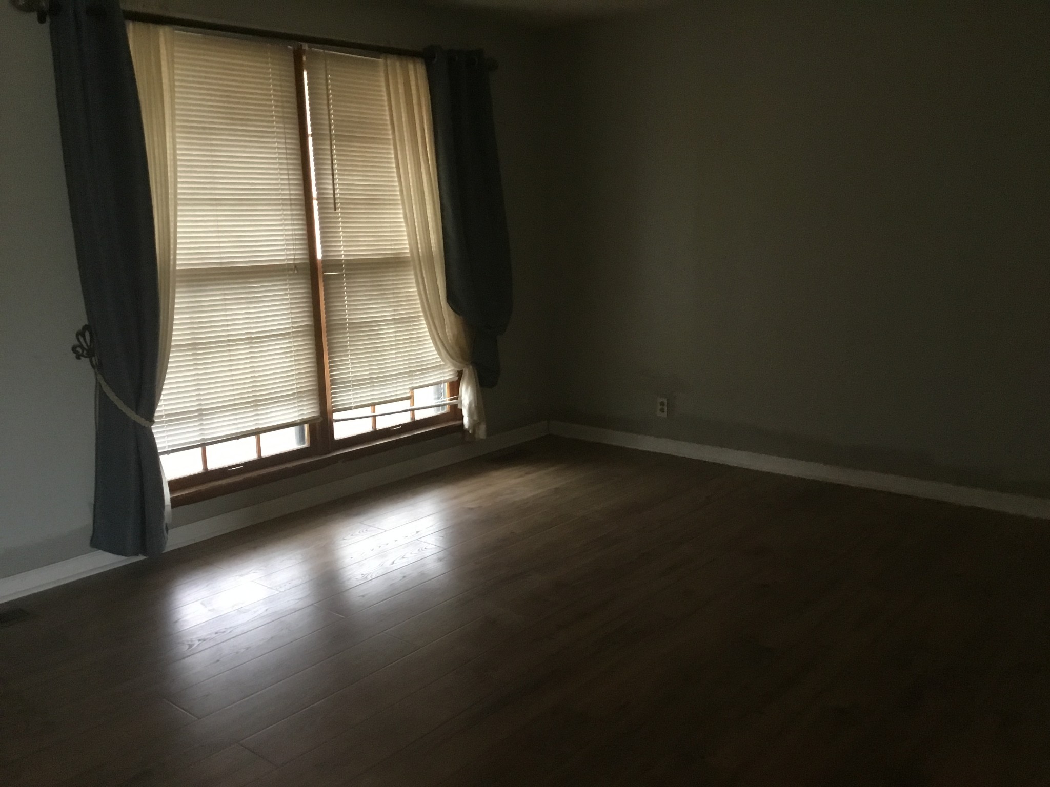 2780 Holloway Road Lebanon, TN 37090 - Photo 5 of 5 an empty room with wooden floor and windows