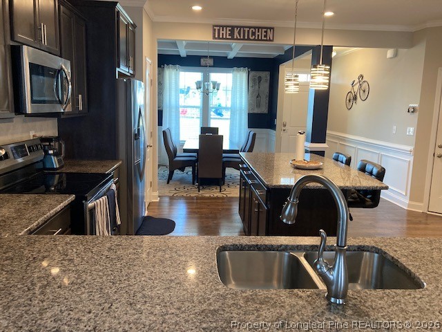 144 Haynes Church Road Raeford, NC 28376 - Photo 6 of 24 a kitchen with kitchen island granite countertop a sink a stove and a refrigerator