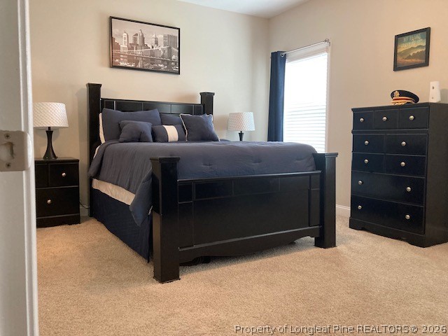 144 Haynes Church Road Raeford, NC 28376 - Photo 10 of 24 a bedroom with a bed and a night stand