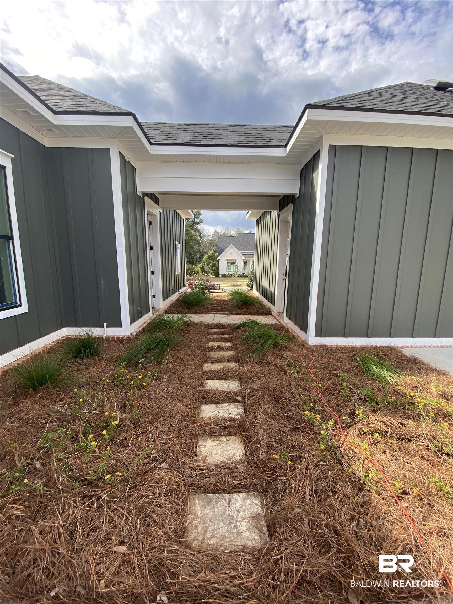 21928 Veranda Boulevard Fairhope, AL 36532 - Photo 12 of 16 Breezeway, butterfly garden & walkway 10.24.22