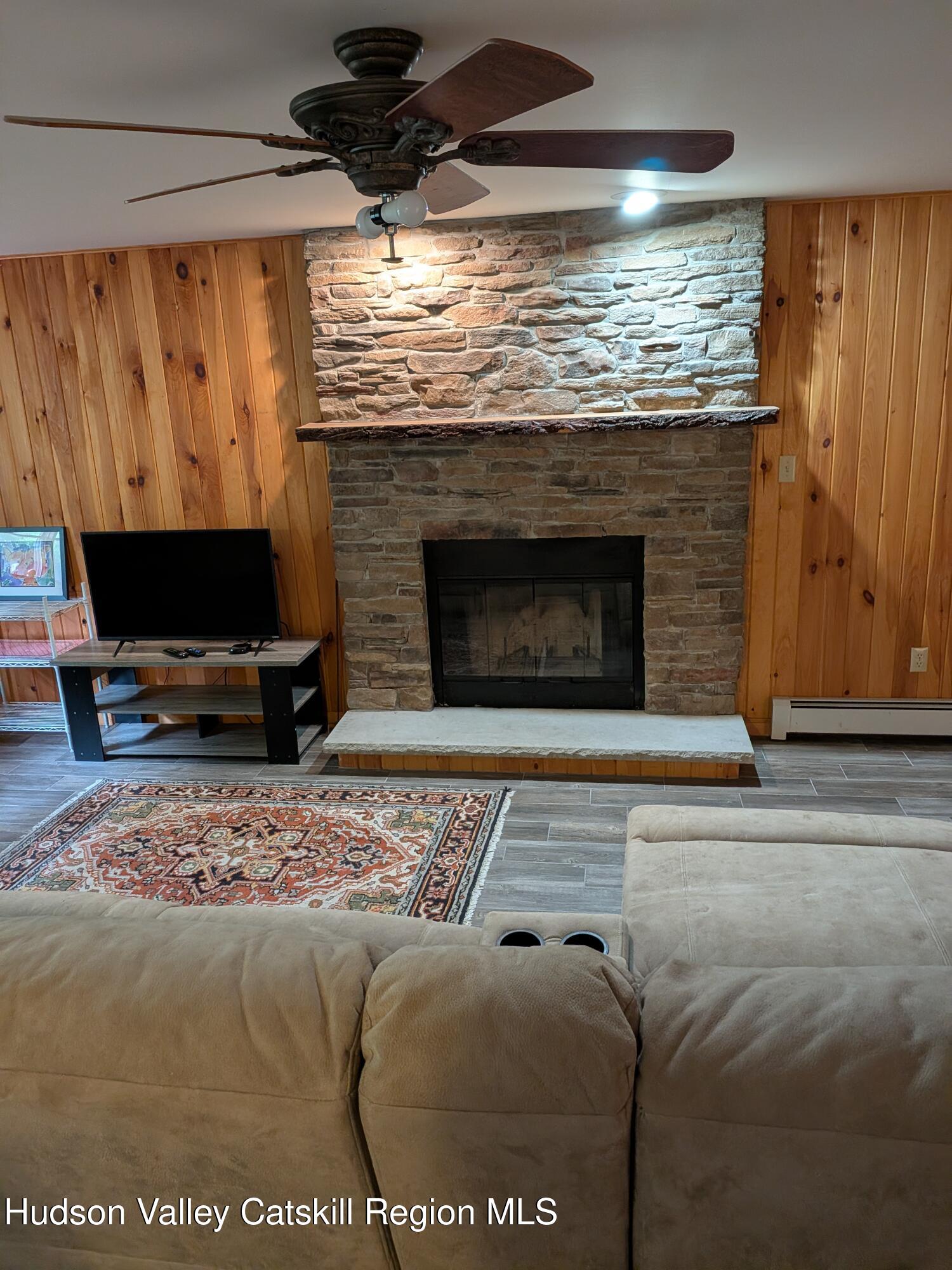 513 South Mountain Road Gardiner, NY 12525 - Photo 32 of 63 a living room with a fireplace furniture and a fireplace