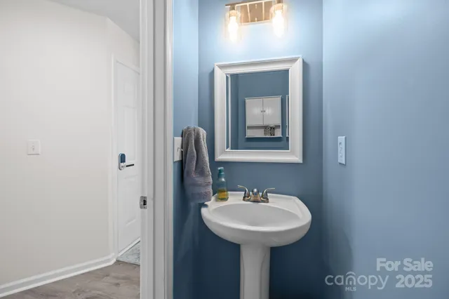 a bathroom with a sink and mirror