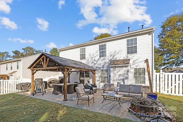 a view of a chairs and table in the patio