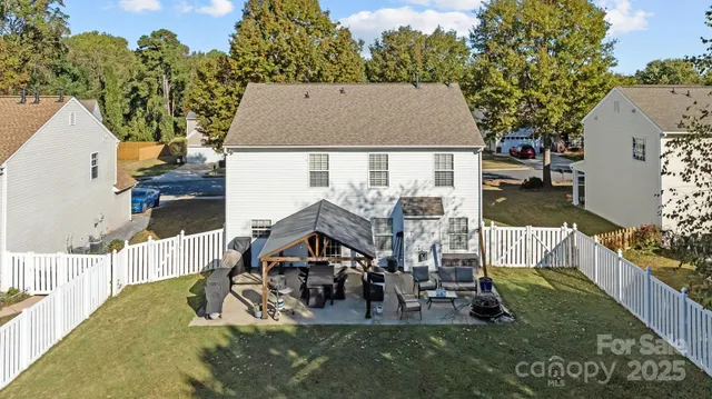 an aerial view of a house with outdoor space