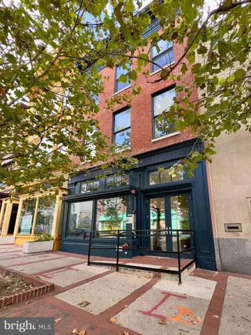 a building with a tree in front of it