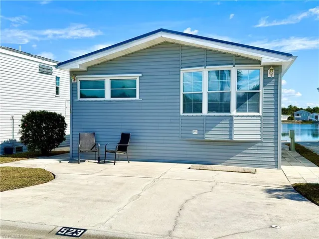 a view of house with yard