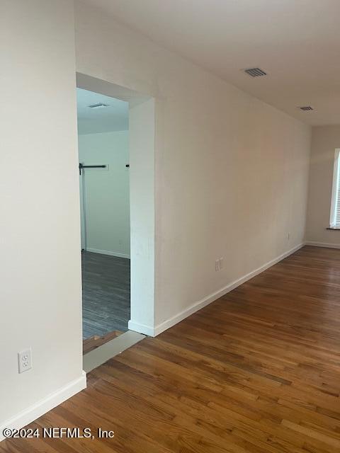 10322 State Rte 100 Starke, FL 32091 - Photo 8 of 15 wooden floor in a hall with an empty room