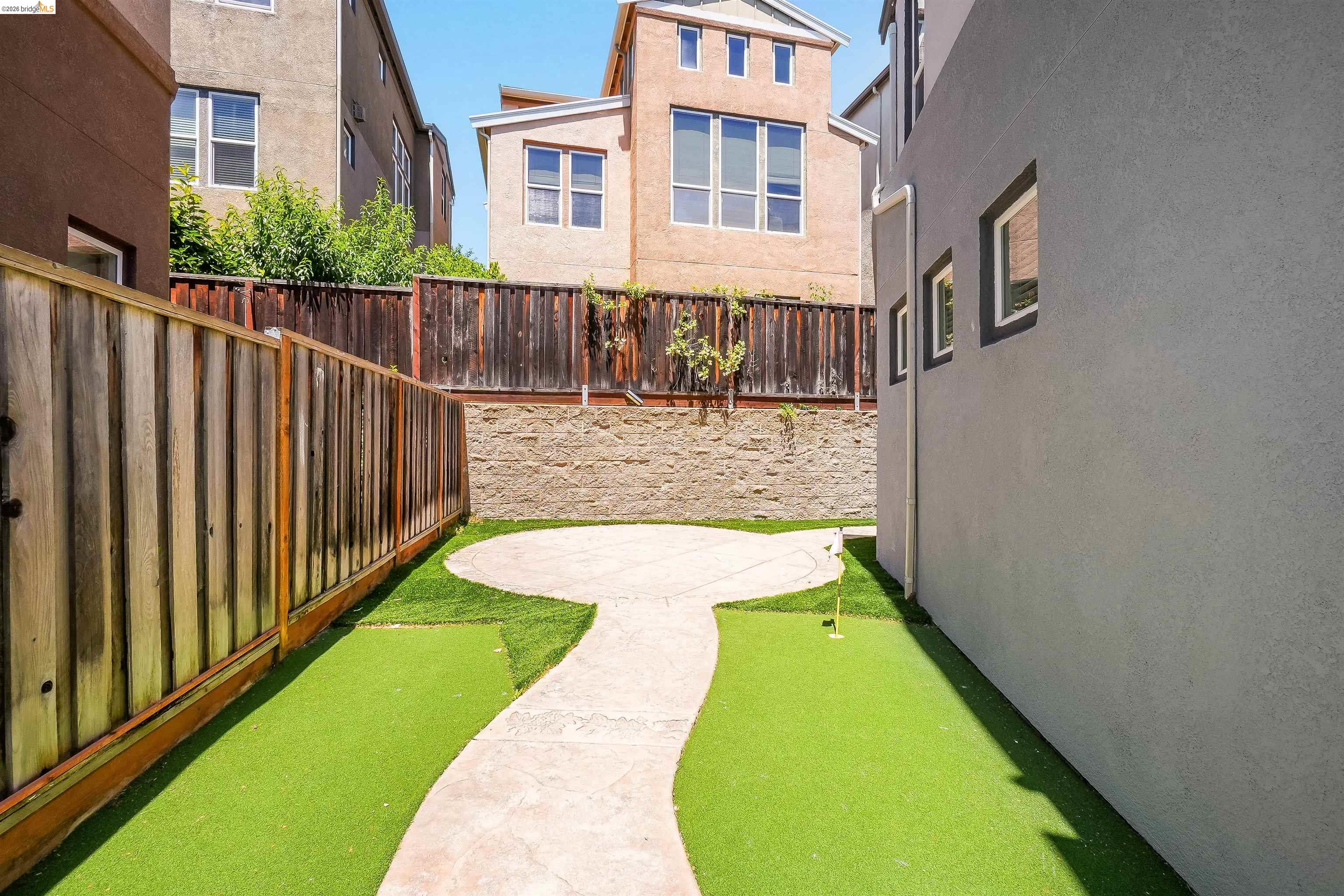 449 Constantine Court San Ramon, CA 94583 - Photo 59 of 63 Rear yard featuring a putting green, concrete patio, and privacy fencing