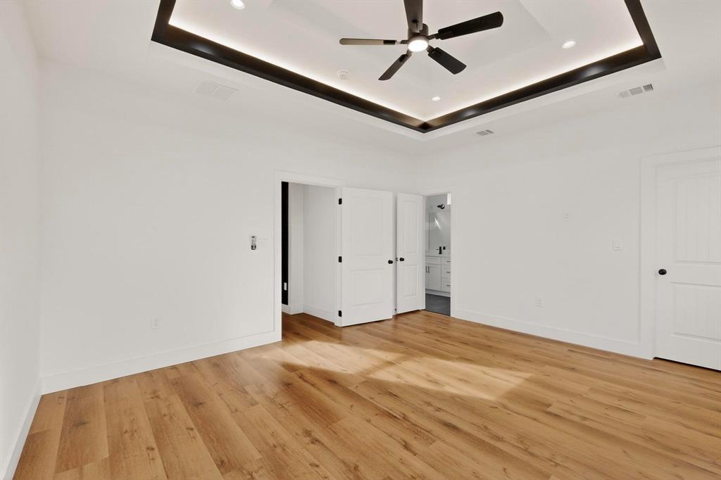 6039 Plum Dale Road Dallas, TX 75241 - Photo 16 of 38 a view of a big room with wooden floor