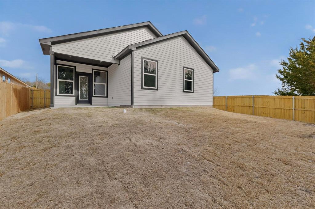 6039 Plum Dale Road Dallas, TX 75241 - Photo 34 of 38 a view of a house with a backyard