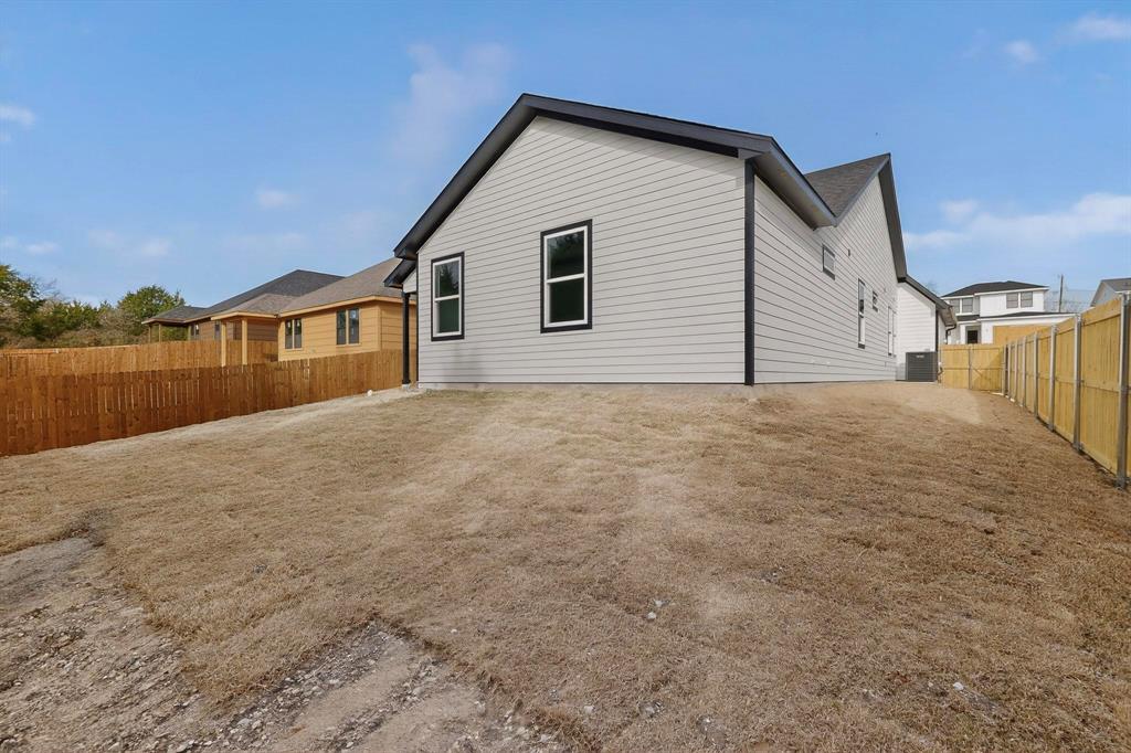 6039 Plum Dale Road Dallas, TX 75241 - Photo 35 of 38 a view of a house with backyard and lake view