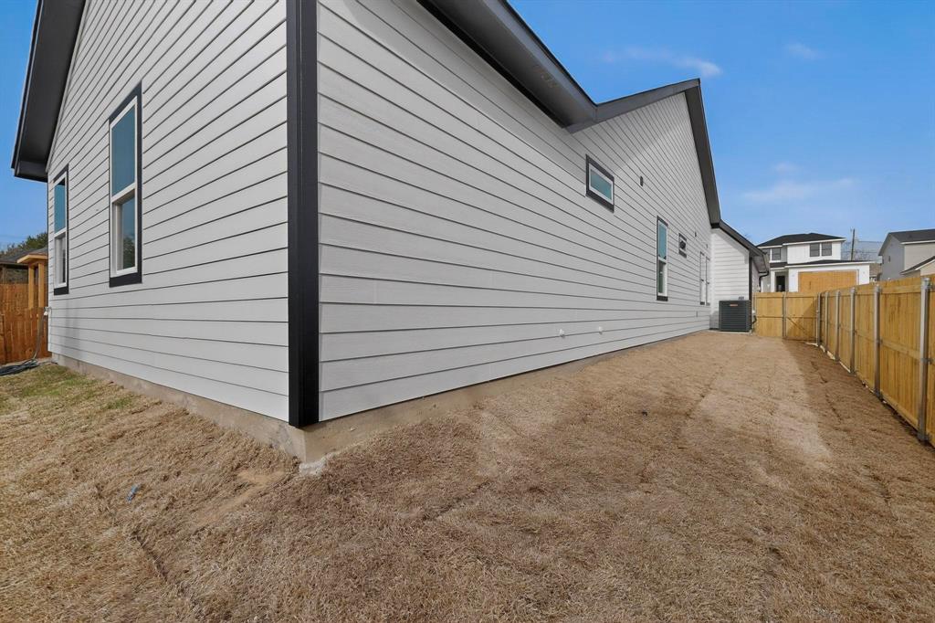 6039 Plum Dale Road Dallas, TX 75241 - Photo 36 of 38 a view of a house with a backyard