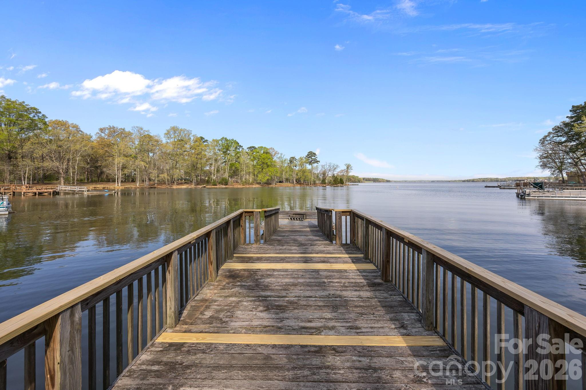 1870 Scout Road Salisbury, NC 28146 - Photo 12 of 48 a view of a balcony with wooden floor and lake view