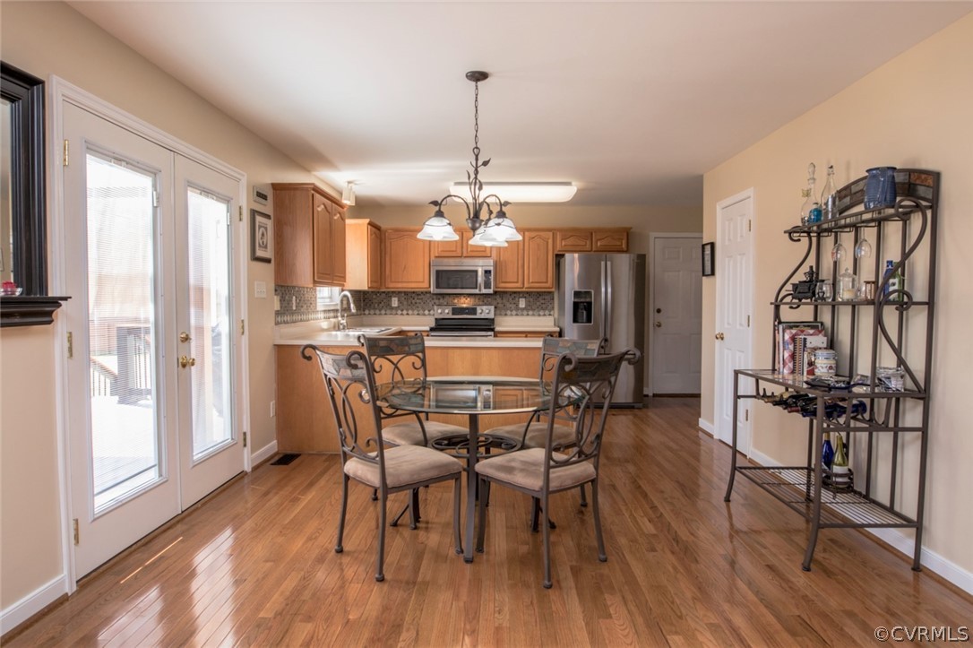 13513 Brandy Oaks Road Chesterfield, VA 23832 - Photo 5 of 38 Eat-in section continues with NEW hardwood floor,