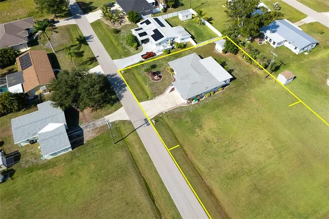 an aerial view of residential house with swimming pool
