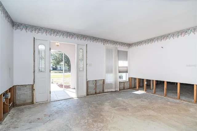 a view of an empty room with a window