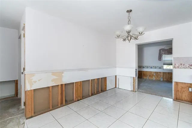 a spacious bathroom with a double vanity sink and a mirror