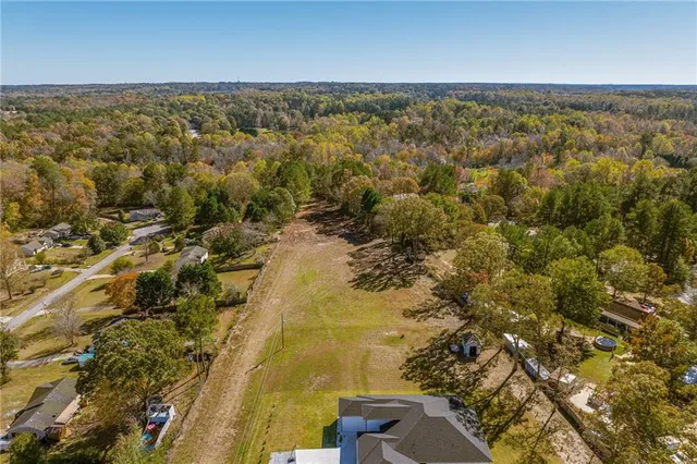 a view of a field with an ocean view
