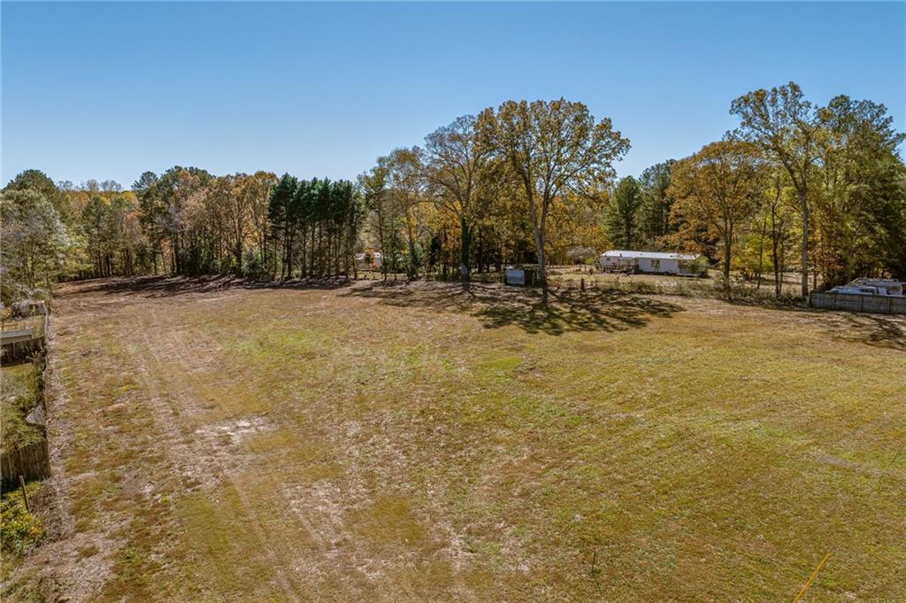 335 Wages Road Auburn, GA 30011 - Photo 15 of 35 a view of a yard with a tree