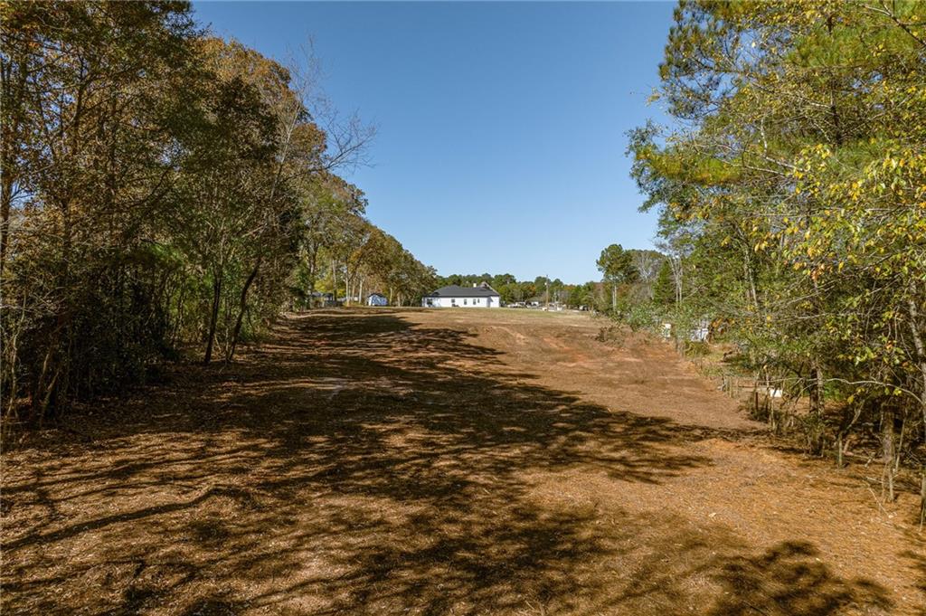 335 Wages Road Auburn, GA 30011 - Photo 19 of 35 a view of lake view and tree