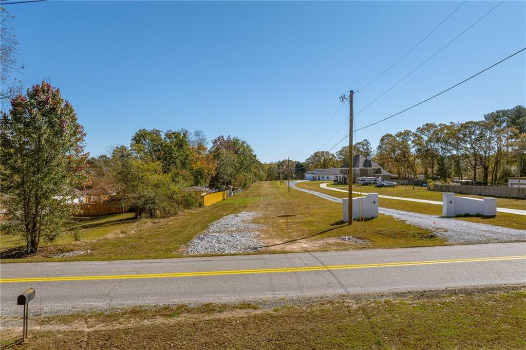 335 Wages Road Auburn, GA 30011 - Photo 2 of 35 a view of a swimming pool with a lake view